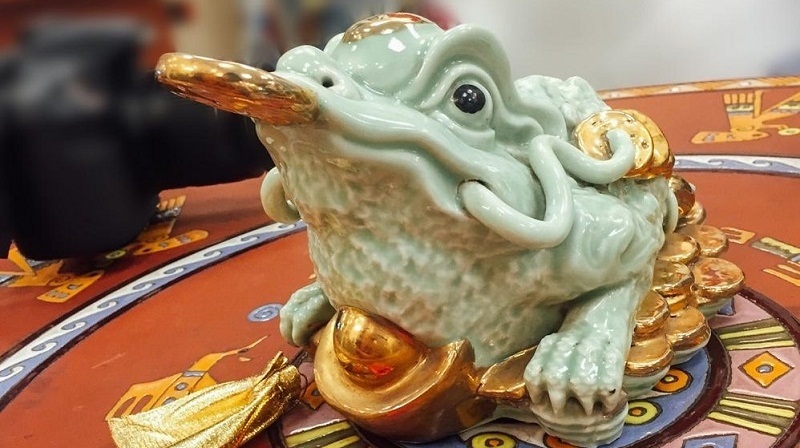 ý nghĩa tượng trung của cóc ngậm tiền